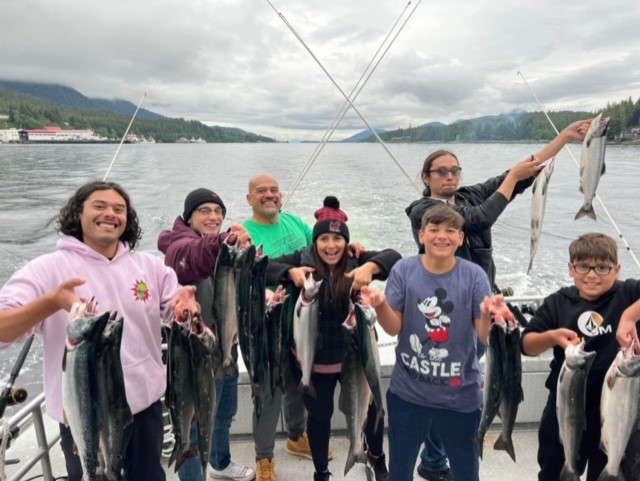 Family Catching Fish On Our Private Charter