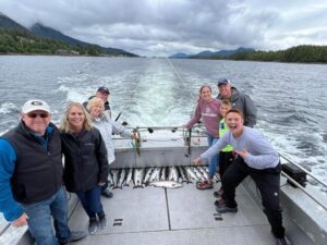 Family Catching Fish on a Private Charter