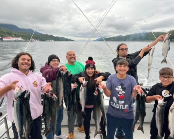 Family Catching Fish On Our Private Charter