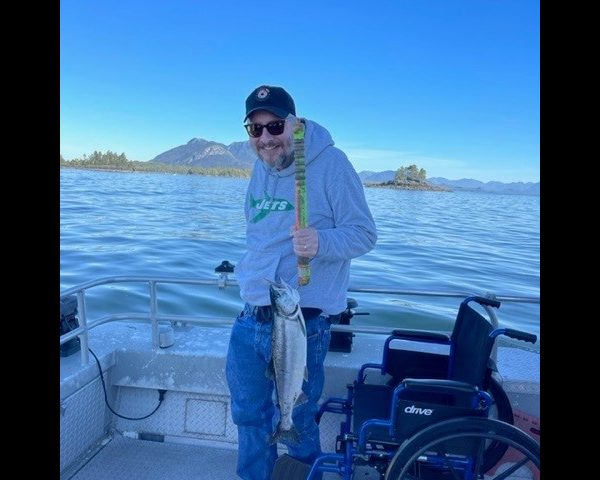 Wheelchair Friendly man on boat with fish