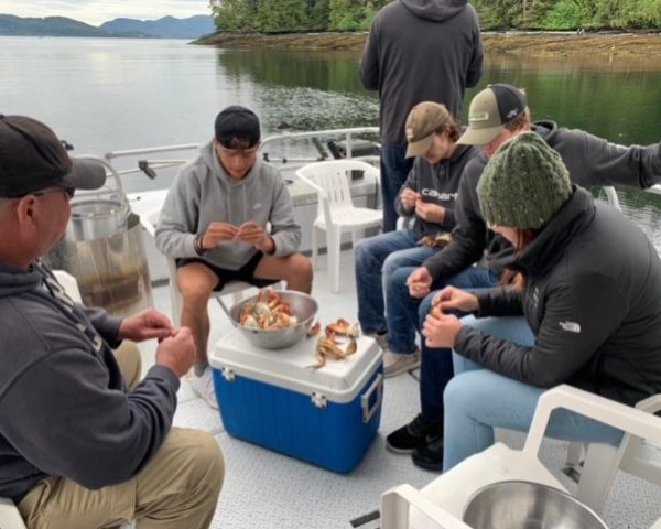 people eating crabl egs on boat